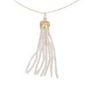 A close-up of a long gold and white freshwater cultured pearl tassel necklace