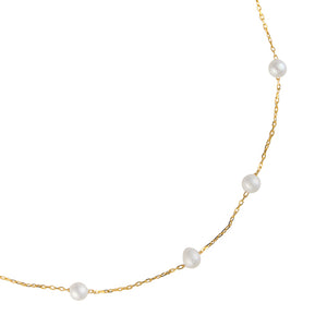 Tin cup with small freshwater pearl necklace in gold