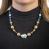 Vibrant gold, pearl, and gemstone necklace