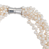 A close-up of a image of a five-strand white cultured keshi pearl necklace with a magnetic clasp