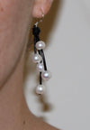 Hanging pearl and leather strand earrings