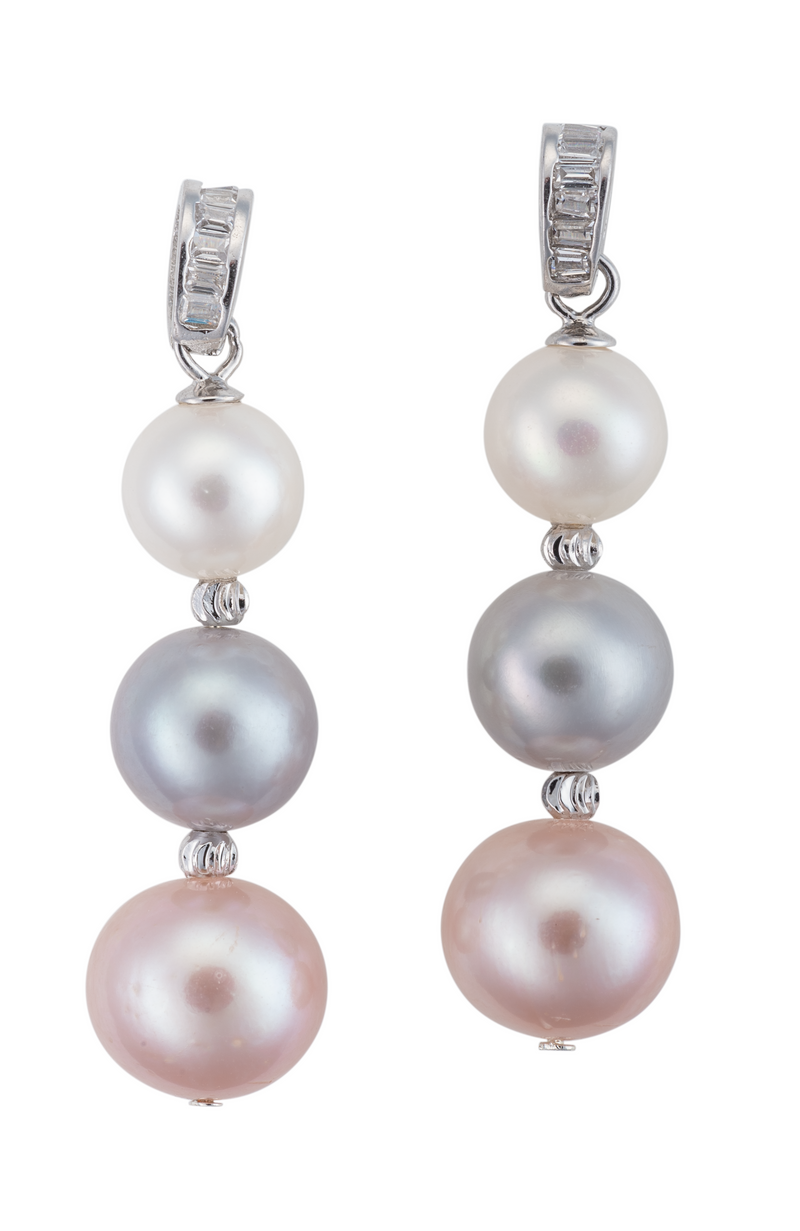 An image of black and white three pearl earrings, with crystal accents.