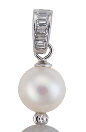 A close-up image of a freshwater cultured white pearl, part of pink, gray, and white three pearl earrings, with crystal accents.