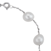 An close-up of a tin-cup stainless steel bracelet with white freshwater cultured pearls.