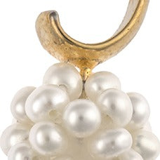 A close-up of white snowball cluster pearl earrings on 14k gold plating